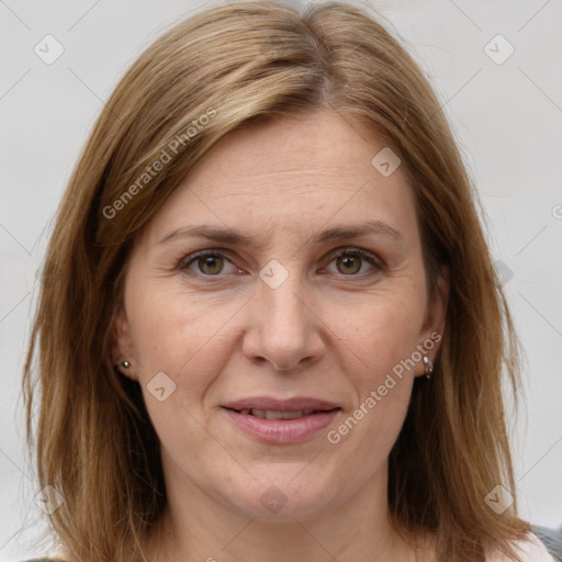 Joyful white adult female with medium  brown hair and grey eyes