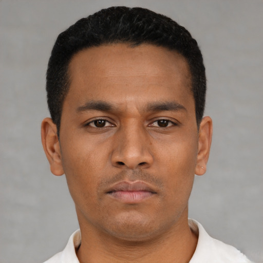 Neutral latino young-adult male with short  black hair and brown eyes