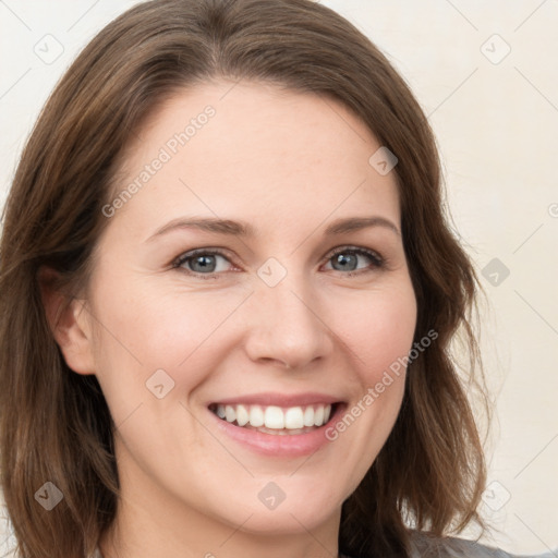 Joyful white young-adult female with medium  brown hair and green eyes