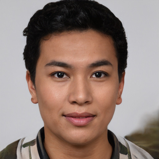 Joyful asian young-adult male with short  black hair and brown eyes