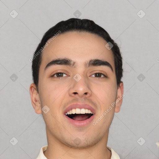 Joyful white young-adult male with short  black hair and brown eyes