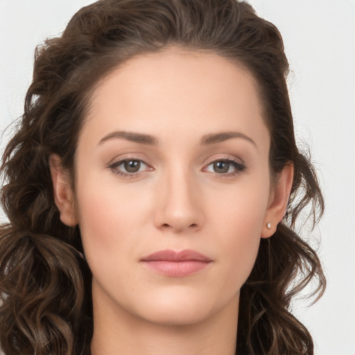 Neutral white young-adult female with long  brown hair and brown eyes