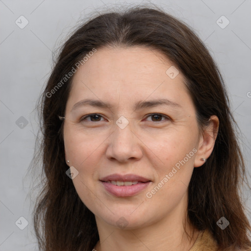 Joyful white adult female with long  brown hair and brown eyes