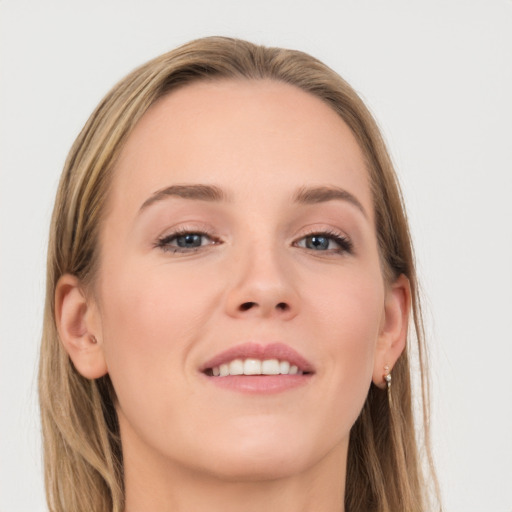 Joyful white young-adult female with long  brown hair and grey eyes