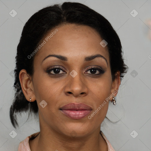 Joyful black adult female with medium  brown hair and brown eyes