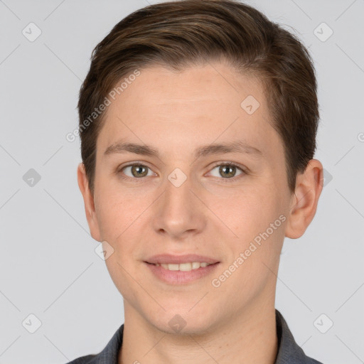 Joyful white young-adult male with short  brown hair and grey eyes