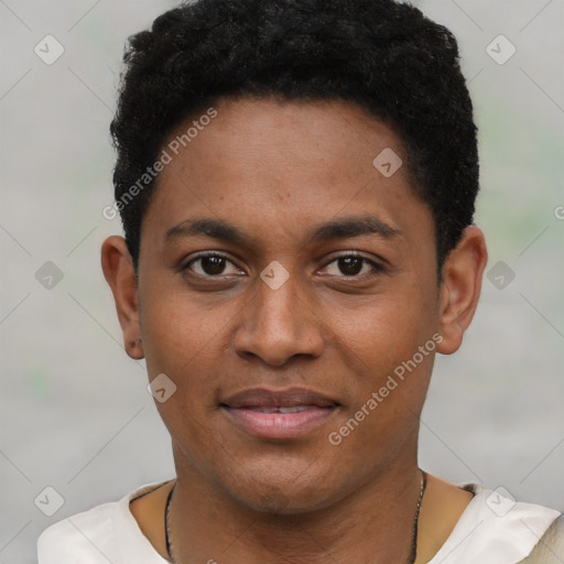 Joyful black young-adult male with short  black hair and brown eyes