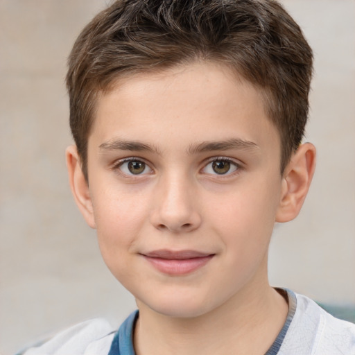 Joyful white child male with short  brown hair and brown eyes