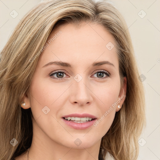 Joyful white young-adult female with long  brown hair and green eyes