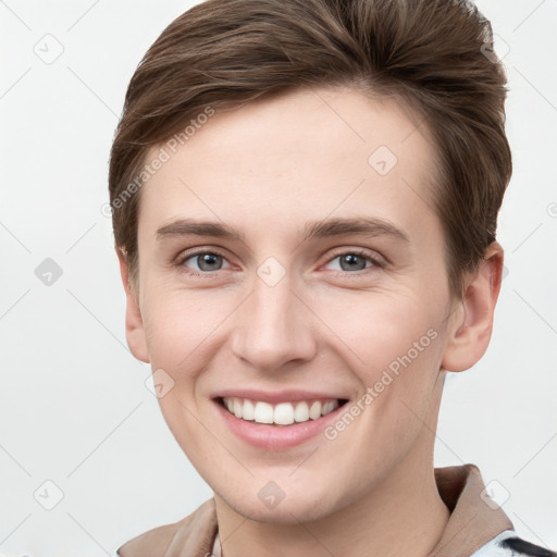 Joyful white young-adult female with short  brown hair and grey eyes