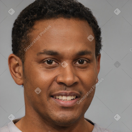 Joyful latino young-adult male with short  brown hair and brown eyes