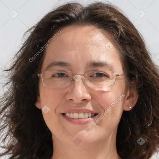 Joyful white adult female with long  brown hair and brown eyes