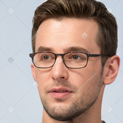 Joyful white adult male with short  brown hair and brown eyes