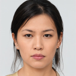 Neutral asian young-adult female with medium  brown hair and brown eyes