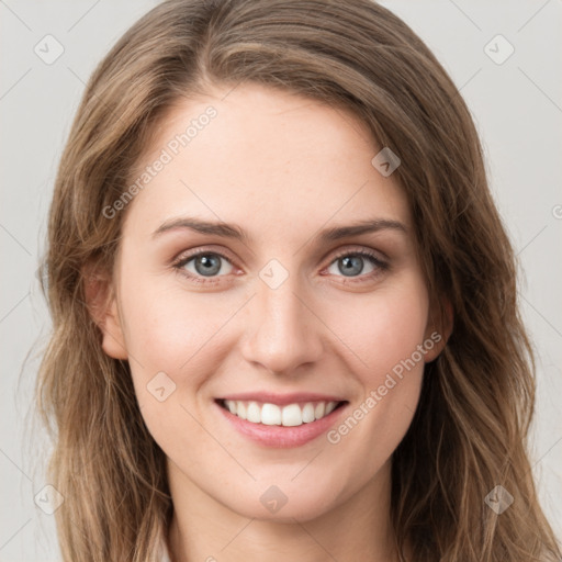 Joyful white young-adult female with long  brown hair and green eyes