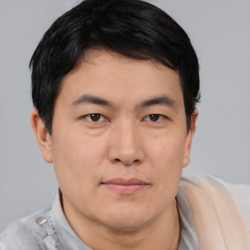 Neutral asian young-adult male with short  brown hair and brown eyes