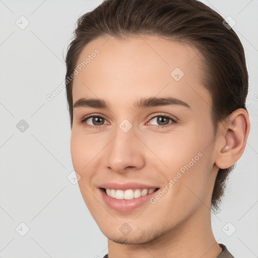 Joyful white young-adult female with short  brown hair and brown eyes