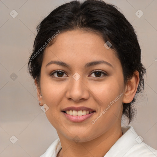 Joyful latino young-adult female with medium  brown hair and brown eyes