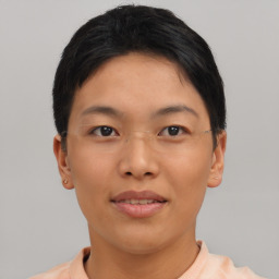 Joyful asian young-adult female with short  black hair and brown eyes