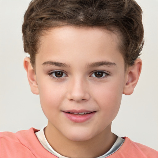 Joyful white child male with short  brown hair and brown eyes