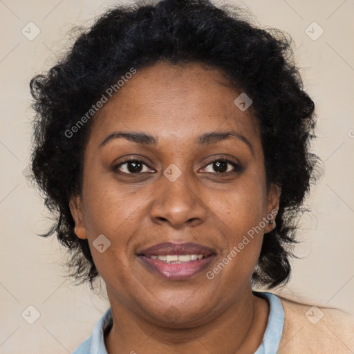 Joyful black adult female with short  brown hair and brown eyes