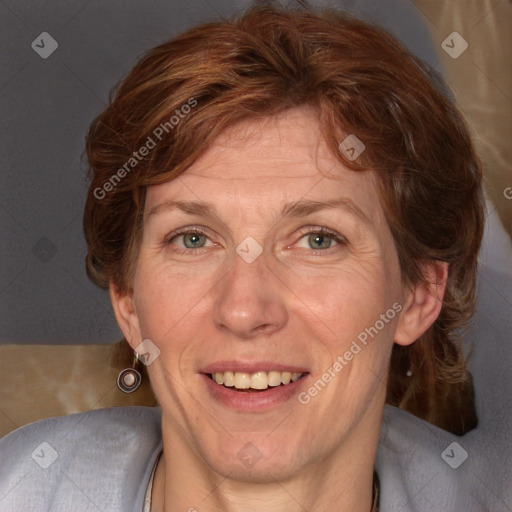 Joyful white adult female with medium  brown hair and blue eyes