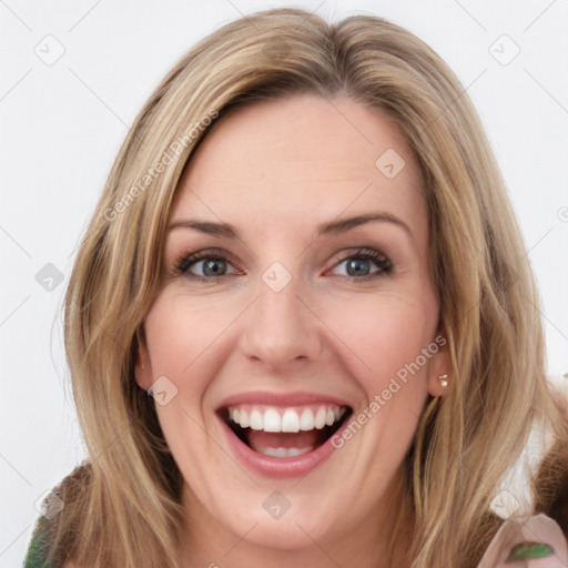 Joyful white young-adult female with long  brown hair and green eyes