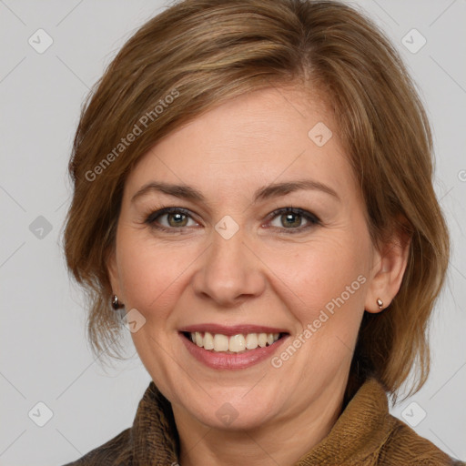 Joyful white adult female with medium  brown hair and brown eyes