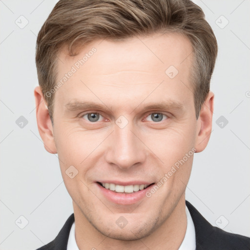 Joyful white adult male with short  brown hair and grey eyes