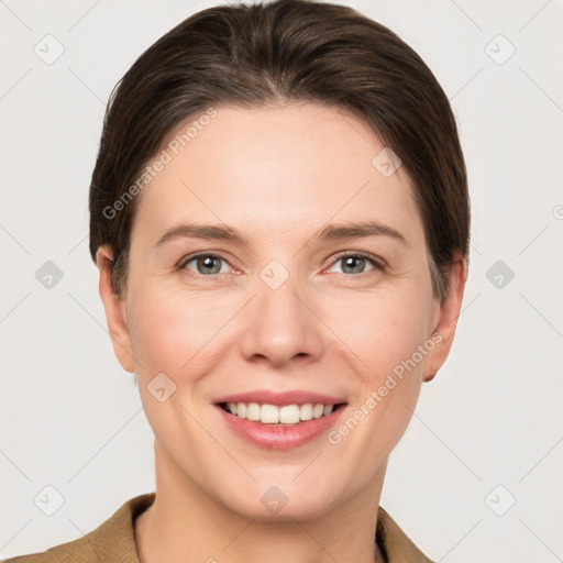 Joyful white young-adult female with short  brown hair and grey eyes