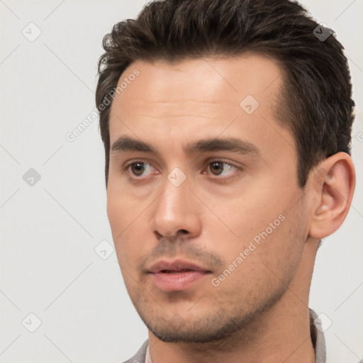 Neutral white young-adult male with short  black hair and brown eyes