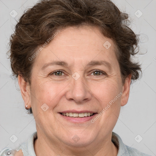 Joyful white adult female with short  brown hair and brown eyes