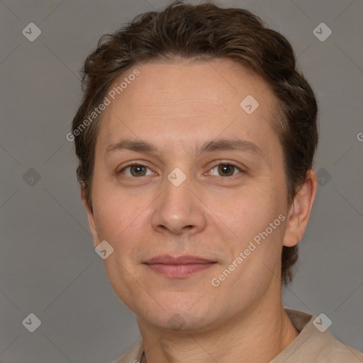 Joyful white adult male with short  brown hair and grey eyes