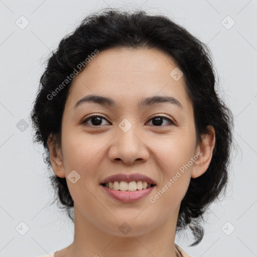 Joyful latino young-adult female with medium  brown hair and brown eyes