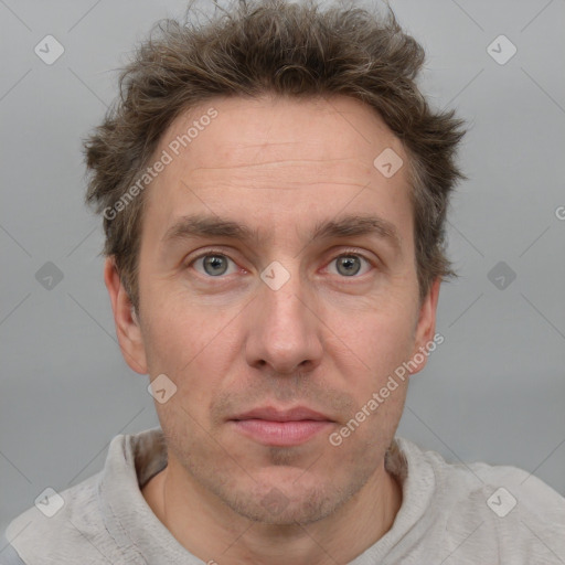 Joyful white adult male with short  brown hair and grey eyes