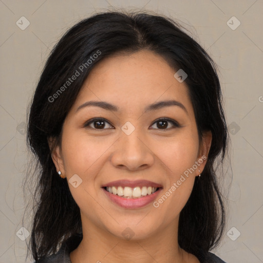 Joyful latino young-adult female with medium  brown hair and brown eyes