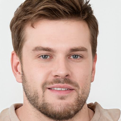 Joyful white young-adult male with short  brown hair and grey eyes