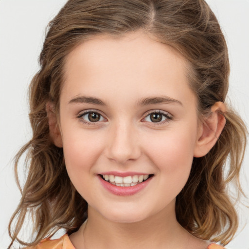 Joyful white child female with medium  brown hair and brown eyes