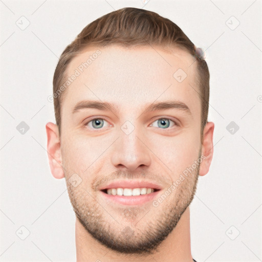 Joyful white young-adult male with short  brown hair and grey eyes