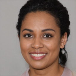 Joyful latino young-adult female with medium  black hair and brown eyes