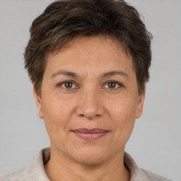 Joyful white adult female with short  brown hair and brown eyes