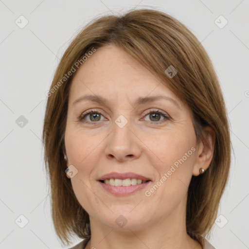 Joyful white adult female with medium  brown hair and grey eyes