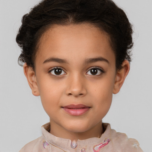 Joyful white child female with short  brown hair and brown eyes