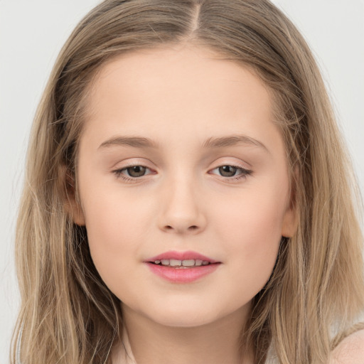 Joyful white child female with long  brown hair and brown eyes