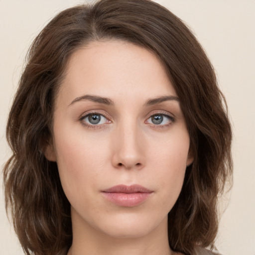 Neutral white young-adult female with medium  brown hair and green eyes