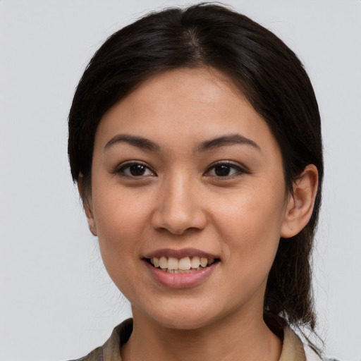 Joyful white young-adult female with medium  brown hair and brown eyes