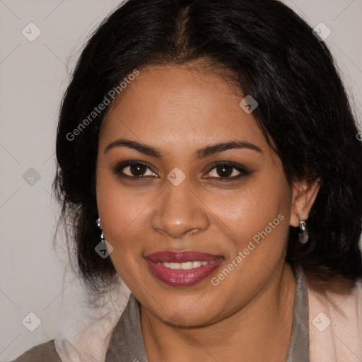 Joyful black young-adult female with long  brown hair and brown eyes