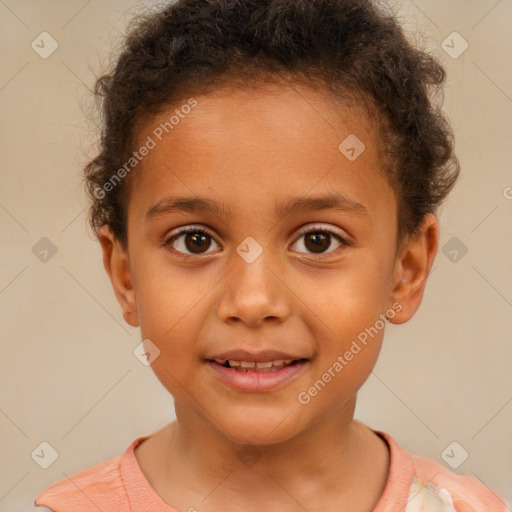 Joyful white child male with short  brown hair and brown eyes