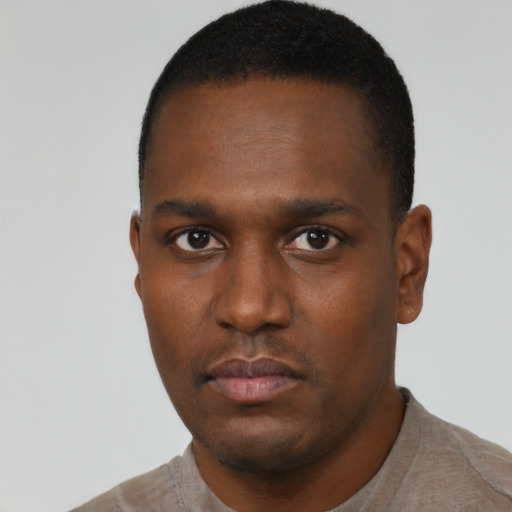 Neutral black young-adult male with short  black hair and brown eyes