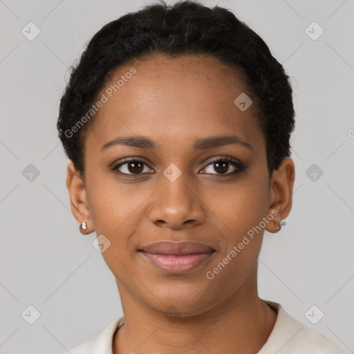 Joyful black young-adult female with short  black hair and brown eyes